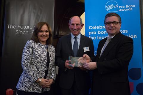 Outstanding Contribution to Pro Bono Michael Napier QC receiving his award from Solicitor General Robert Buckland QC MP and Hilarie Bass (President, American Bar Association)